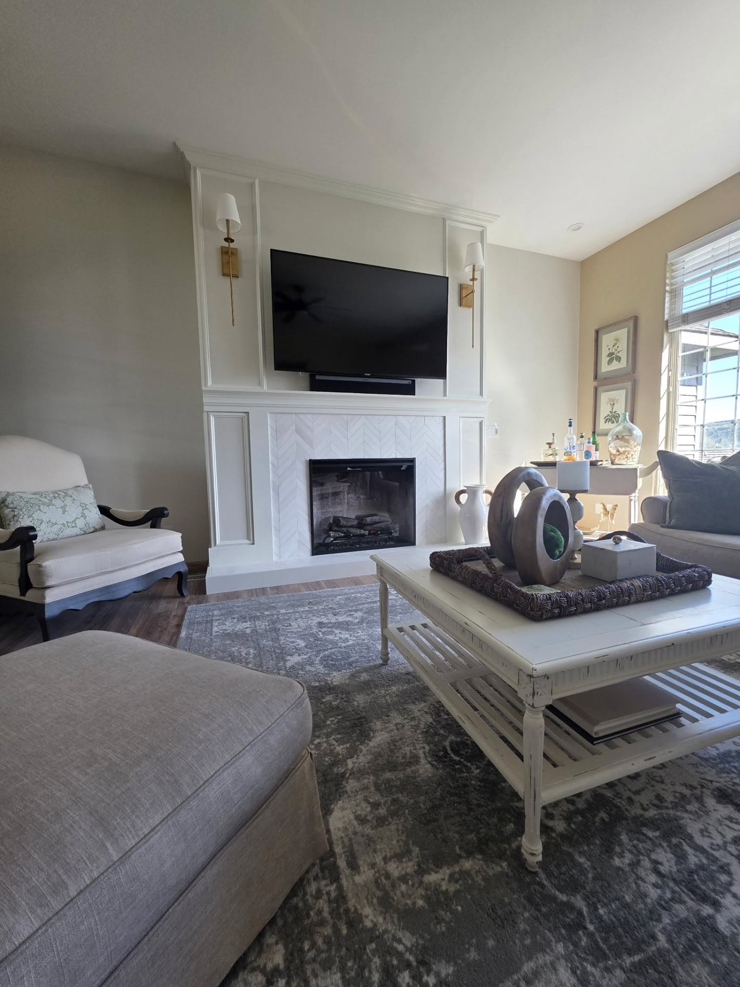 Built-in fireplace surround with paneled millwork and mounted TV in Chelan home