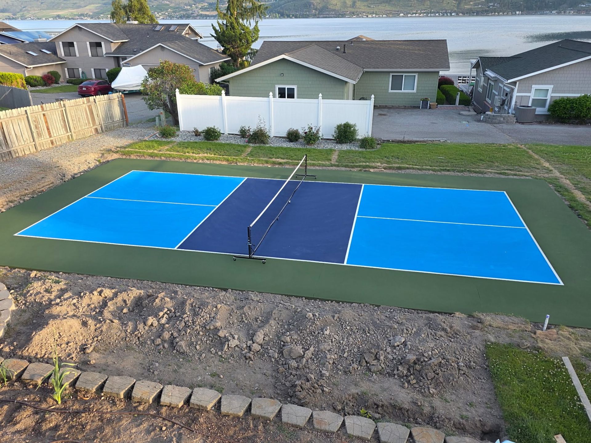 Finished pickleball court color coating and white line striping in Chelan