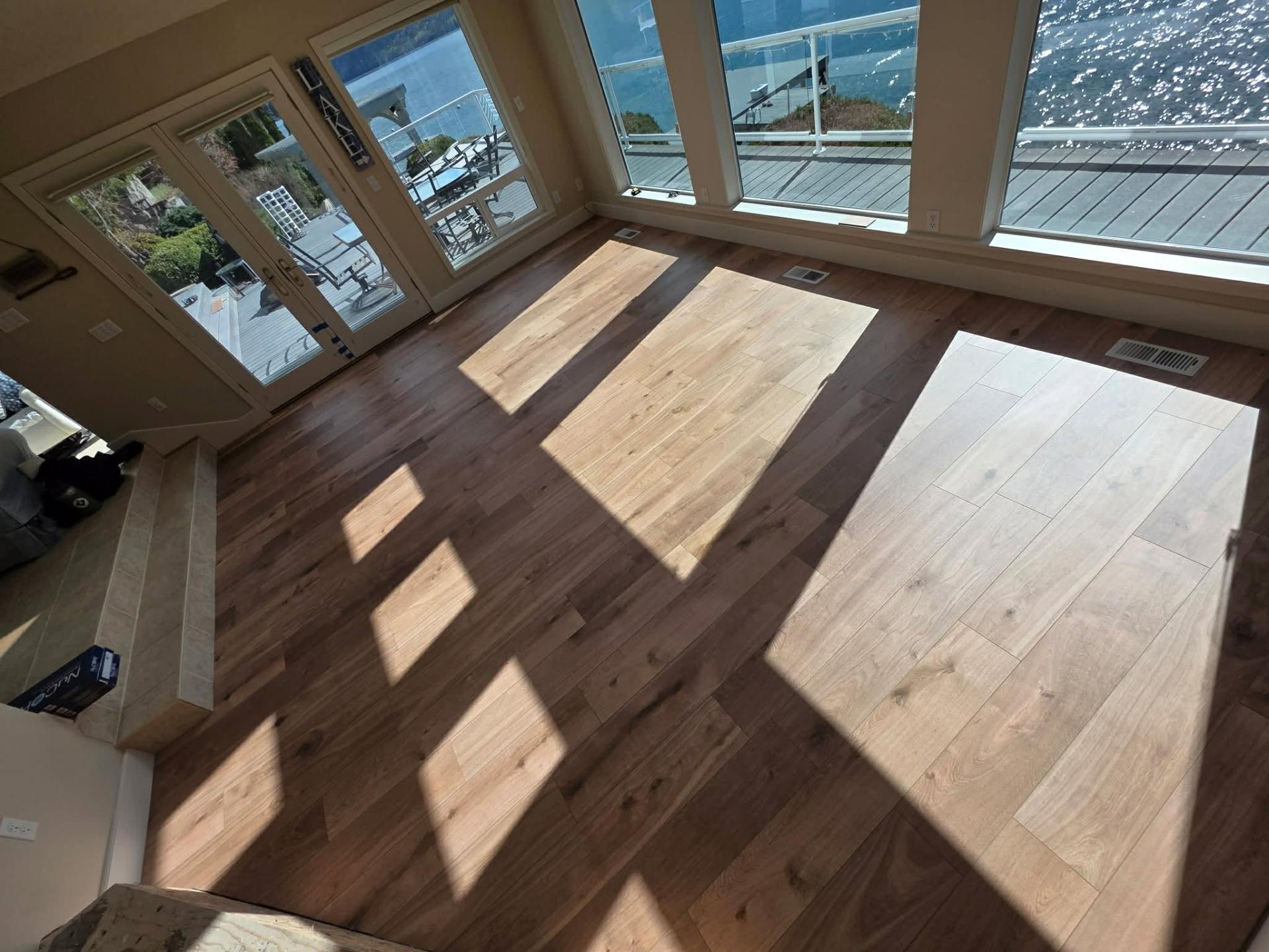 NuCore Performance LVP floor near fireplace and lake-view windows in Chelan WA