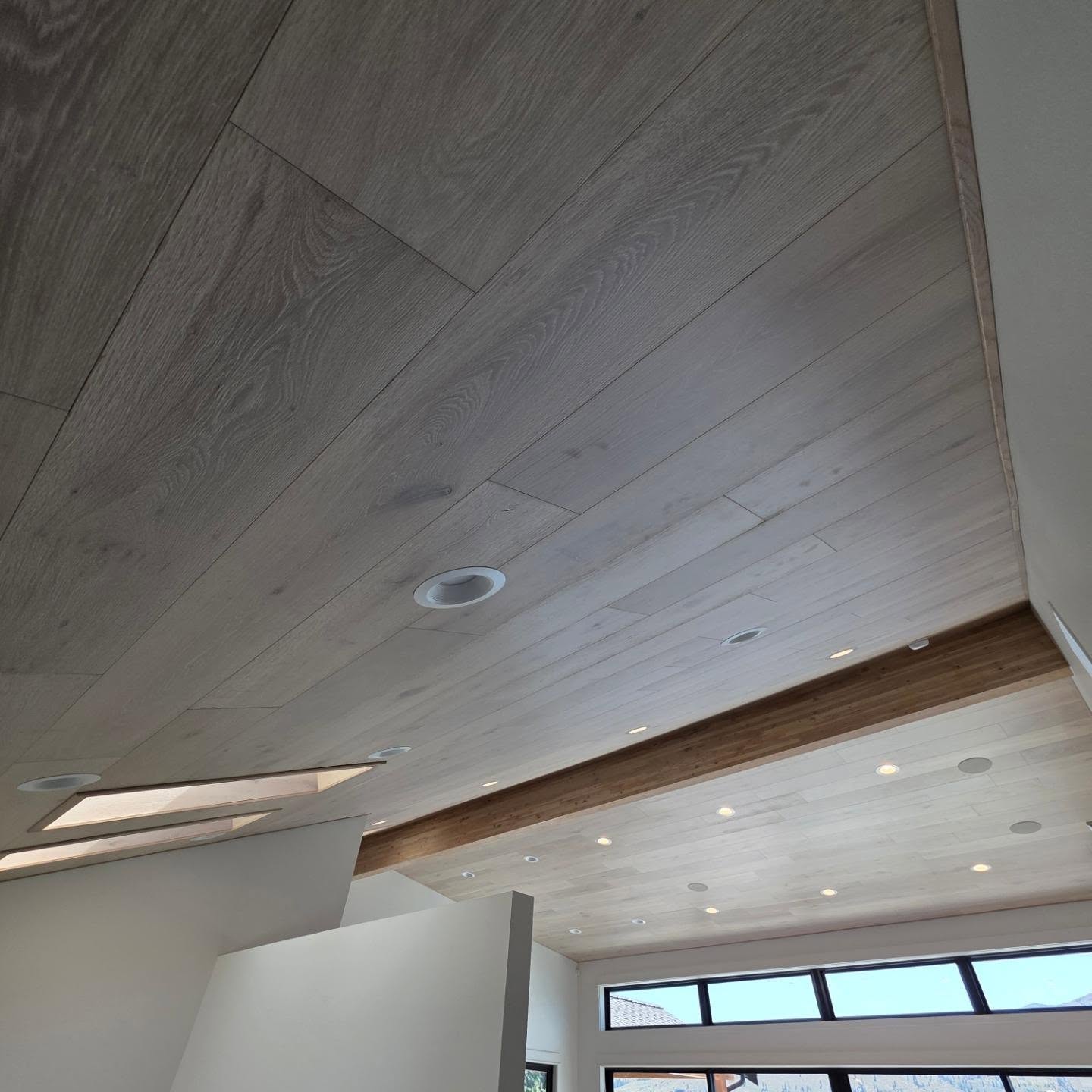 Wide-plank white oak ceiling with smoked finish and recessed lighting in Manson WA