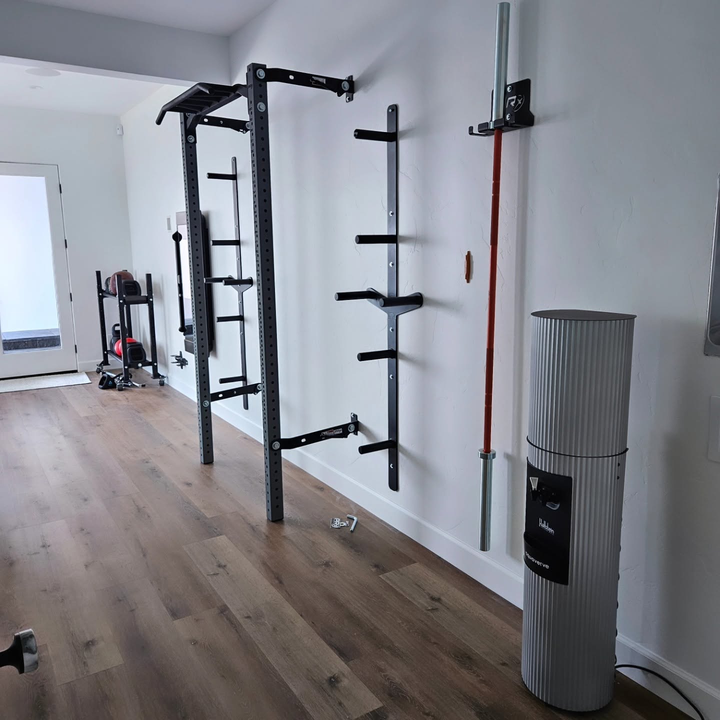 Custom home gym install in Chelan WA with squat rack, barbell holders, and platform